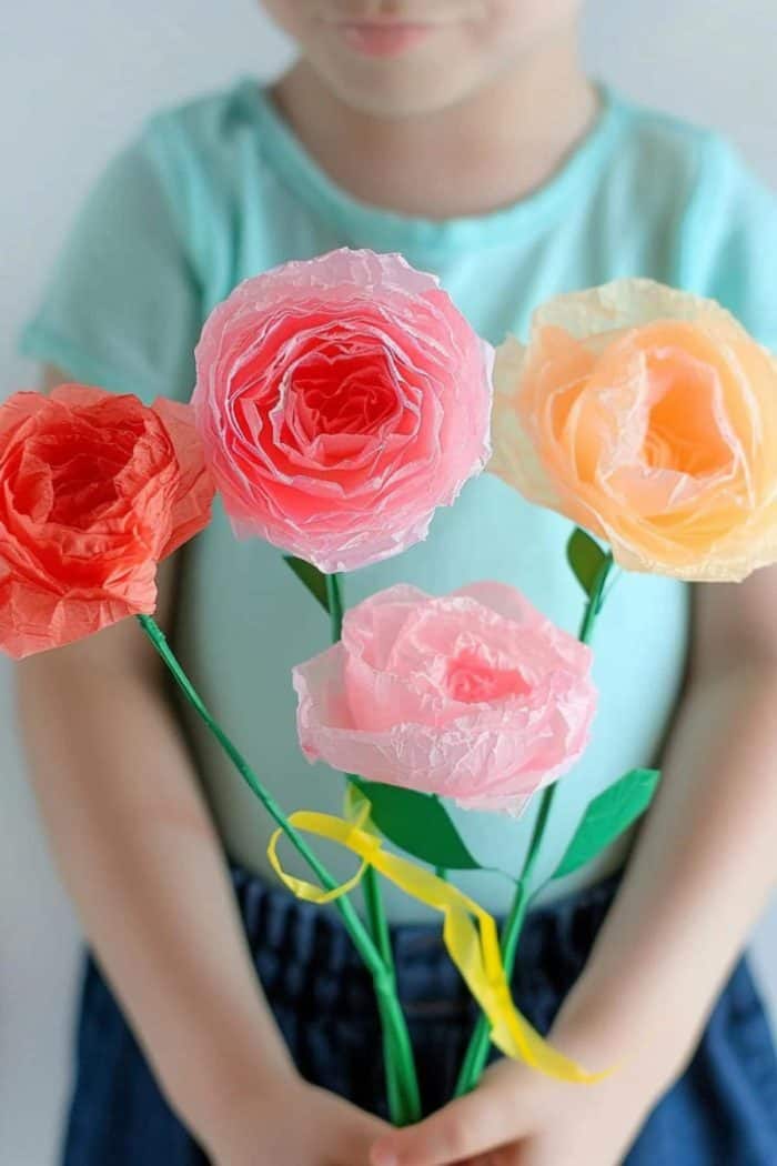 Layers of painted tissue paper are pinched and fluffed into full blooms, allowing young fingers to develop motor skills while also giving Mom a sweet and lovely gift.