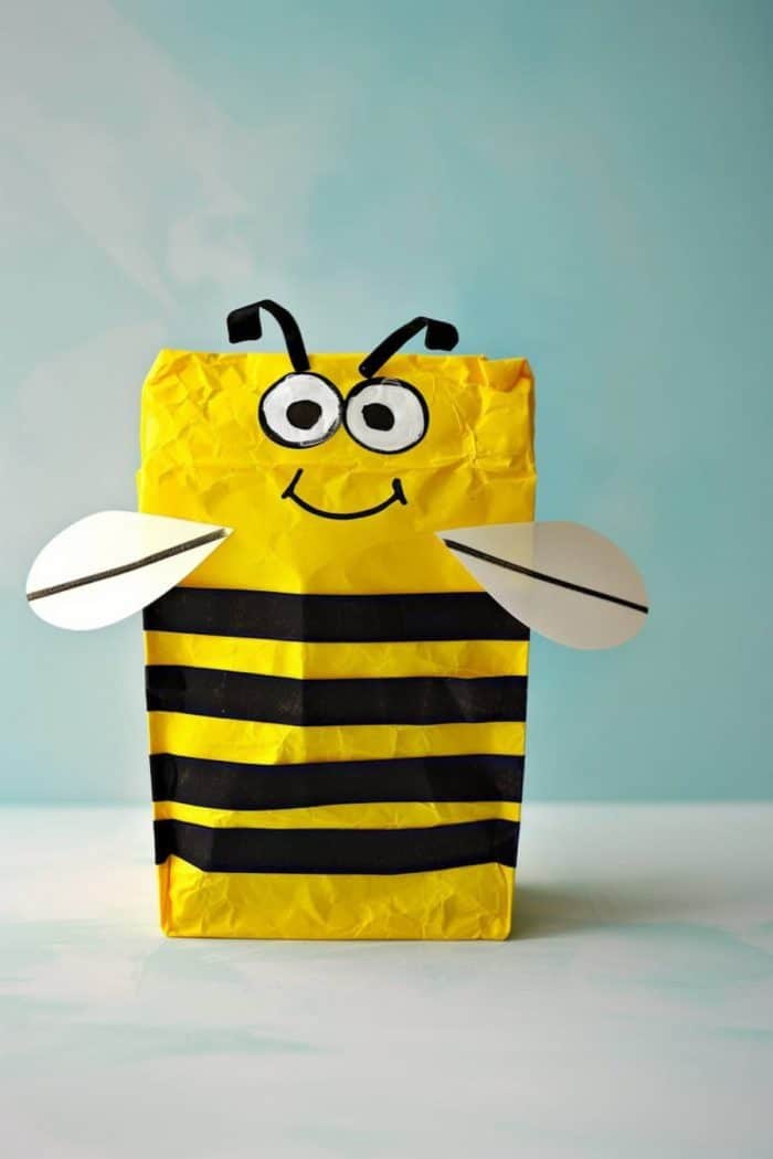 Buzzing with joy, this paper bag bee showcases distinctive yellow and black stripes and round wings.