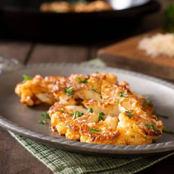 you can serve the cauliflower steaks with a drizzle of balsamic glaze or a sprinkle of chopped fresh herbs for added flavor.