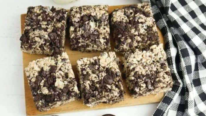Rice Krispies Treats and Oreos placed in a wooden plate