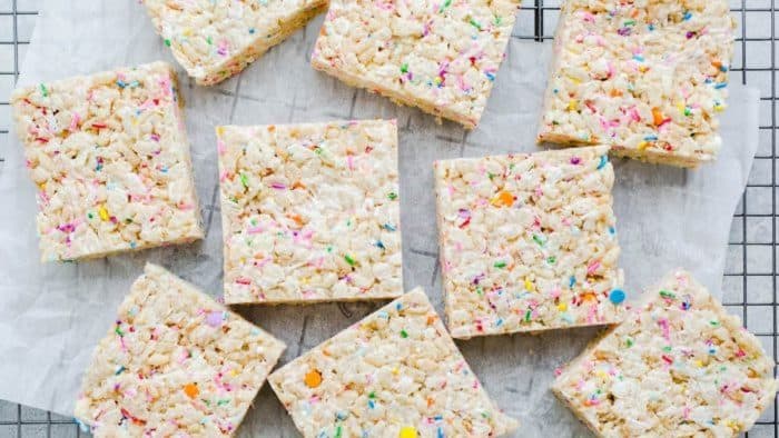 cake batter rice krispie treats made with brown rice cereal, vegan marshmallows and butter, sprinkles, and coconut flour
