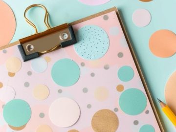 Decorate a clipboard with a polka dot design for a fun and timeless look.