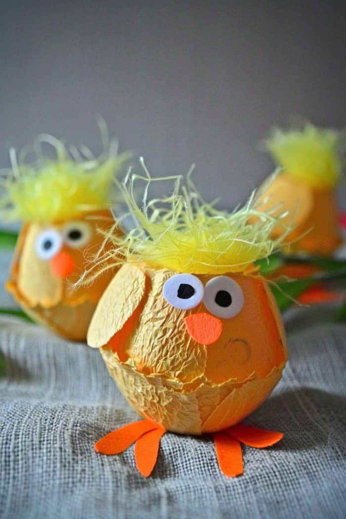 Paint egg carton cups a cheerful yellow and add features like orange paper beaks and small black dots for the eyes. 