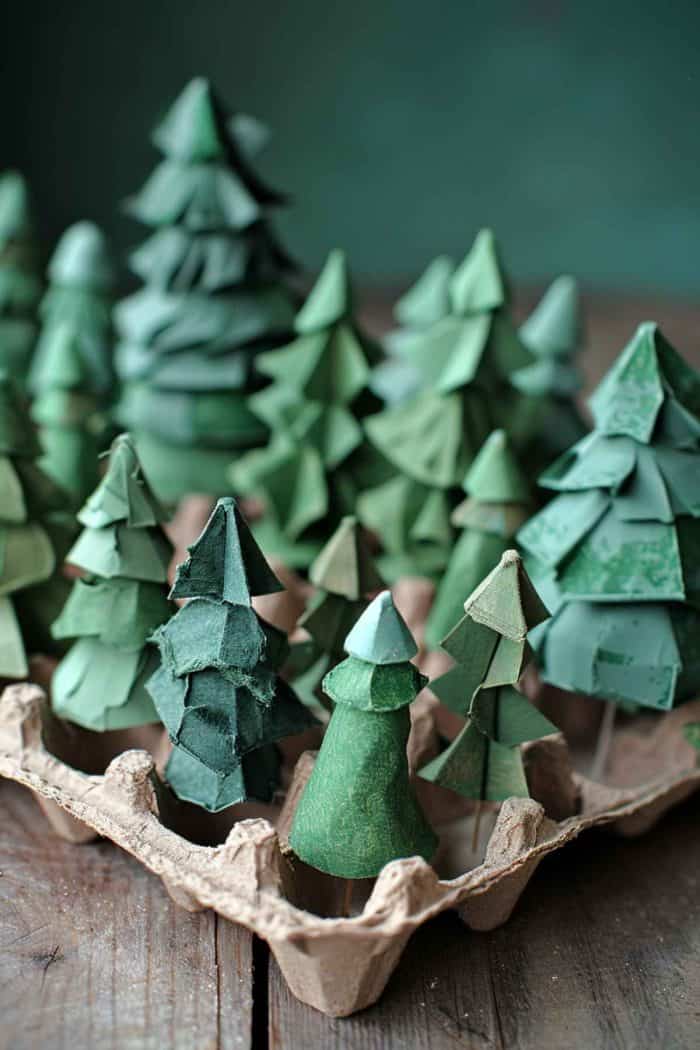 The natural shape of egg cartons can be used to form the base of a forest scene featuring different trees. Top the carton with a variety of trees cut out from egg cartons and cardboard in various shades of green to mimic a dense canopy.