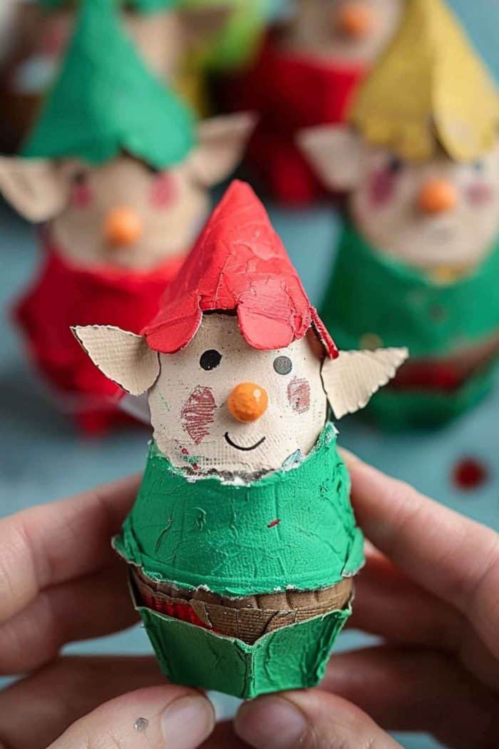Construct elves using egg carton cups for the body, painting them in festive colors. Add pointy ears from cardboard and draw or paint on facial features, dressing them in crafted paper outfits.