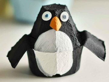 Separate egg carton cups and paint them black and white to mimic a penguin's body. Add orange paper or felt for the beak and feet, and position the penguins in a standing pose to evoke an arctic scene.