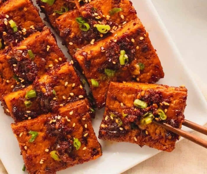 This Korean side dish proves otherwise, with thick slices of tofu absorbing a sweet and spicy braising sauce.