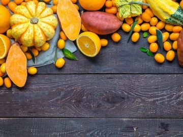 Thanksgiving Autumn Background, Variety of Orange Fruits and Vegetables on Dark Wooden Background