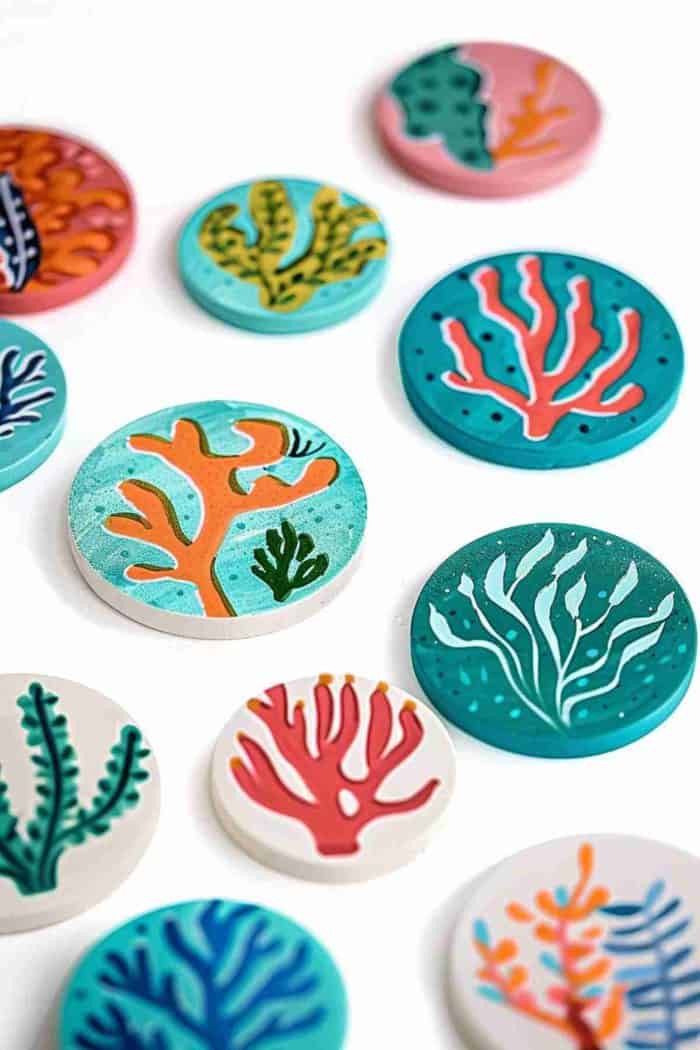 Illustrate the vibrant ecosystem of coral reefs on coasters with detailed depictions of corals. These coasters can add a splash of oceanic beauty to your home, reminiscent of a diving excursion.