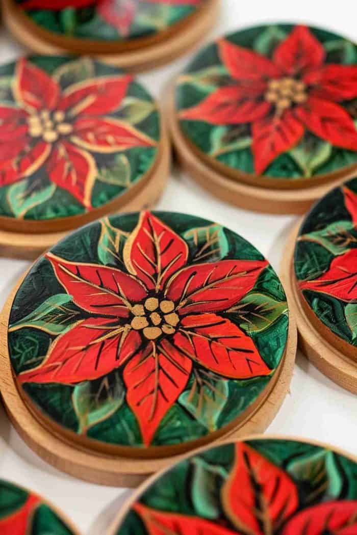 Paint the vibrant red and green of poinsettias on coasters to celebrate the holiday season. These festive coasters can evoke the joyful spirit of Christmas and serve as a charming addition to your holiday decor.