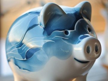 This ceramic piggy bank is painted in a gradient of blues to mimic the ebb and flow of the sea.