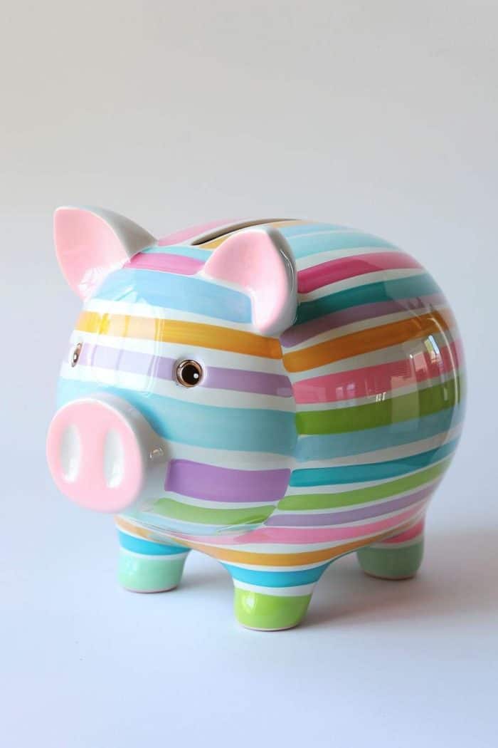 Coated in a glossy, candy-like finish, this piggy bank is adorned with pastel stripes that evoke memories of a candy land.