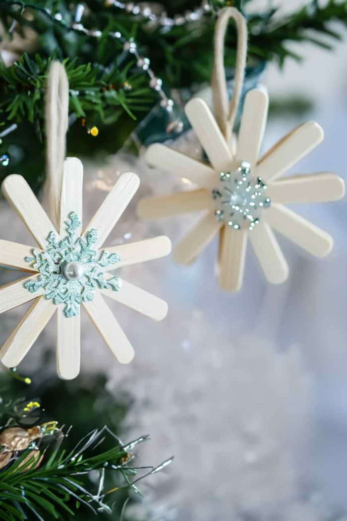 Create intricate snowflake designs using popsicle sticks. Arrange the sticks in various snowflake patterns and glue them together. Once dry, add glittery 3D snowflakes to each one for a sparkly look.