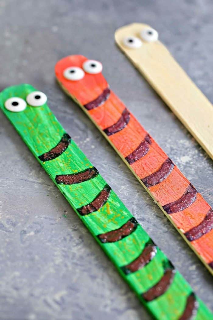 Make playful popsicle stick snakes. Glue several sticks end-to-end in a curved pattern to form the snake's body. 