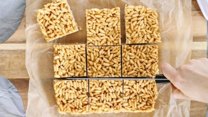 freshly baked naturally sweetened crispy rice cuts into small box pieces