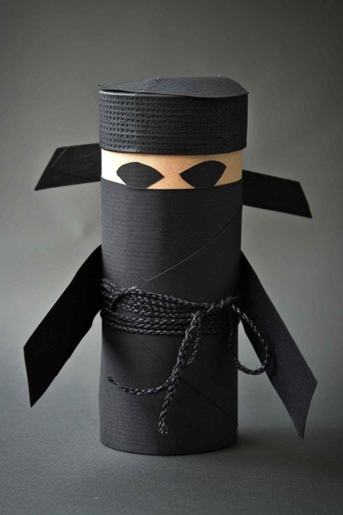 Make ninjas by painting toilet paper rolls in black or dark colors. Cut eyes from black paper and attach them around the roll. 