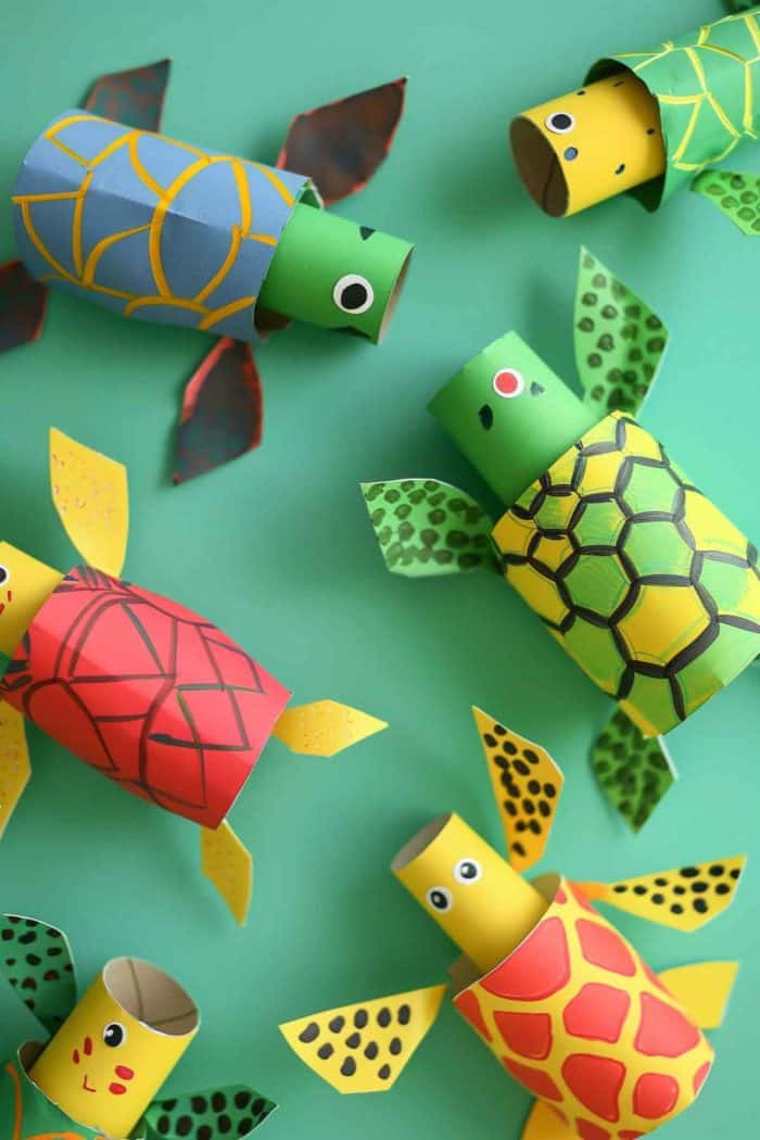 Create turtles by painting toilet paper rolls in a dark green color. Cut out shell patterns from colored paper and glue them on top. 