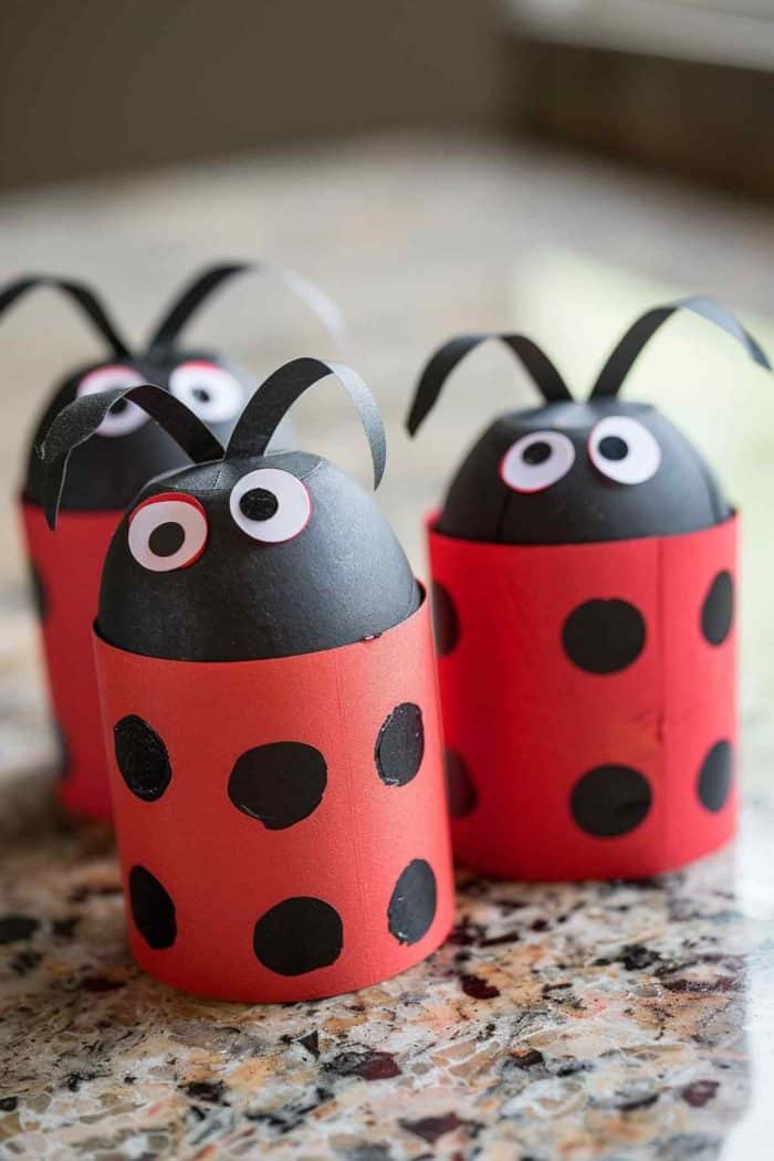Make ladybugs by cutting toilet paper rolls into shorter segments and painting them red. Add painted black spots, then attach a small black paper head with goofy eyes at one end.