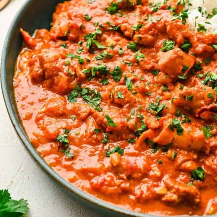 It results in a creamy, decadent sauce with chicken that falls apart at the slightest nudge and goes perfectly with naan flatbread. 