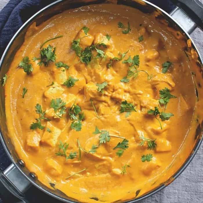 It swaps out chicken for tofu, which is swathed in a creamy vegan masala sauce made with cashews, tomatoes, spices, and aromatics. 