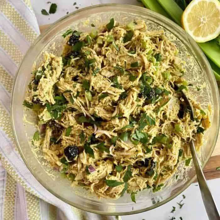 this healthy and flavorful twist, combining shredded chicken with a curry-spiced yogurt dressing. 