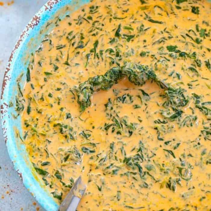 It’s a velvety curry where spinach leaves wilt into a thick, spiced, and tomato-infused gravy with a pour of heavy cream or coconut milk for the perfect finishing touch. 