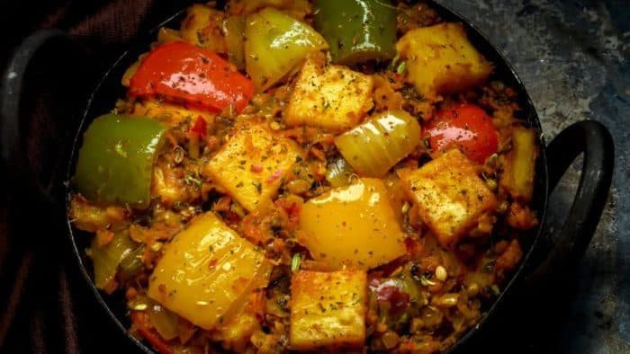 This vibrant dish features spices that are dry-roasted to unlock their aromatic potential then simmered with onions, tomatoes, and a hint of ginger-garlic paste for a rich and textured sauce. 