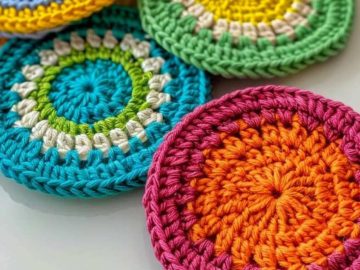 Crafted with care, these coasters display a medley of vivid colors, each crocheted to perfection. 