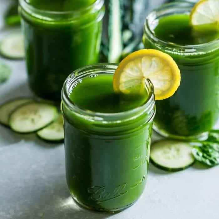 a glass of juice this concoction of kale, cucumber, ginger, apples, and lemon