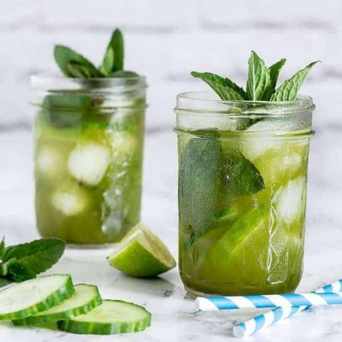 A blend of matcha, gin, lime juice, and cucumber syrup gives this cocktail a crisp, fresh flavor profile, with herbaceous notes from the mint topping. 