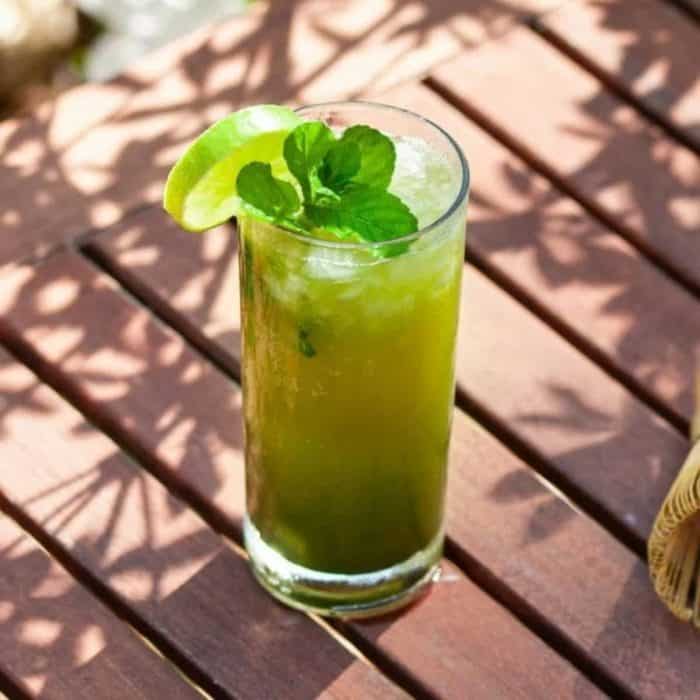 This matcha mojito has it all: herbaceous matcha, cool mint, tangy lime, and sweet rum, all tied together by club soda and sweetened with syrup — perfect for sipping on a balmy Sunday afternoon! 