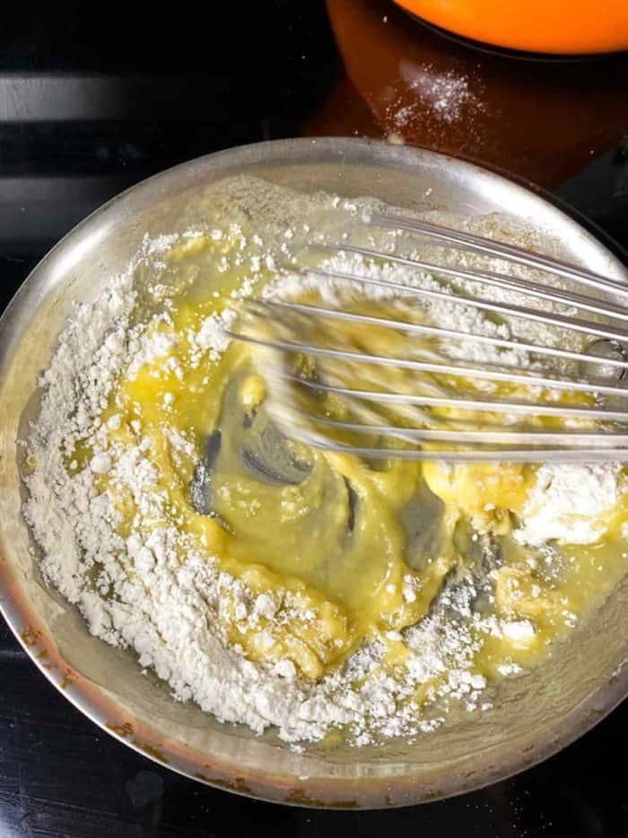 Melt butter in a pan over medium-low heat, then whisk in flour until smooth.