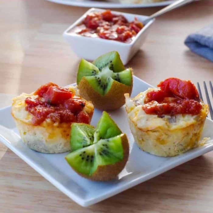 a perfect mix of sausage, hash browns, onions, mushroom soup, sour cream, eggs, and grated cheddar cheese are baked to perfection in a muffin tin