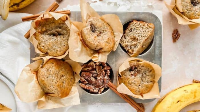 Mashed bananas, roasted walnuts, and Greek yogurt come together to create these delicious muffins with a moist and tender crumb and a surprising crunch.