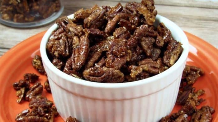 These candied pecans are a delightful combo of nutty and sweet with a satisfying crunch — perfect for topping a creamy cheesecake.