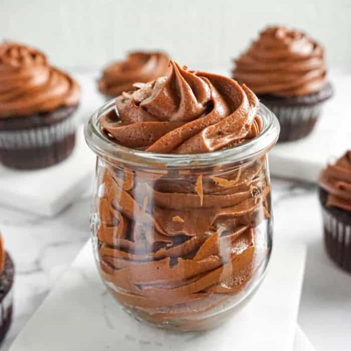 Nothing says indulgence like a blanket of chocolate cinnamon cream cheese frosting over a rich, creamy cheesecake!