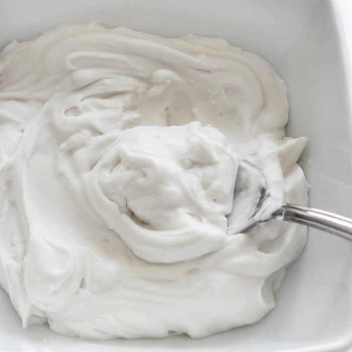Indulge in a light, airy cheesecake topping with this coconut whipped cream!