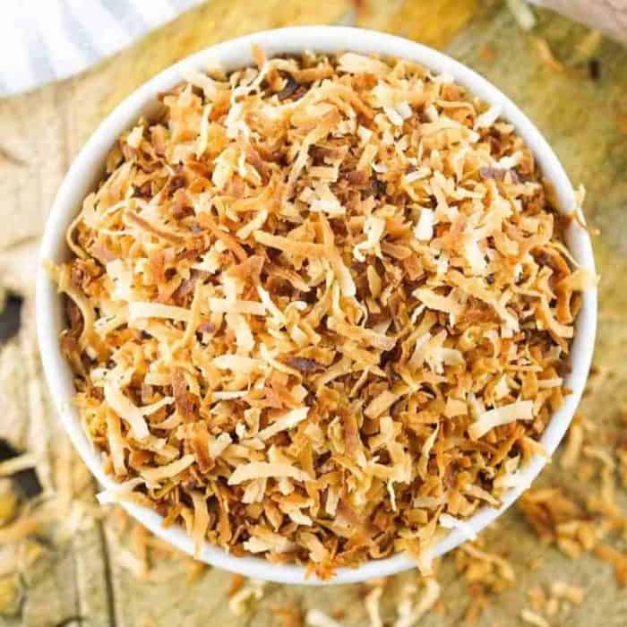 a bowl of bake coconut flakes until they achieve that gorgeous golden brown color.