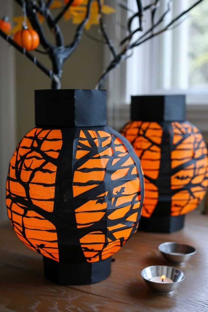 Simple yet eye-catching, these black and orange lanterns — made with both dyed tissue paper and construction paper — create a spooky and festive ambiance! 
