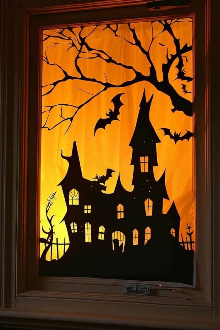 Silhouettes of eerie haunted castles cut from black paper instantly create a chilling effect in any room. 