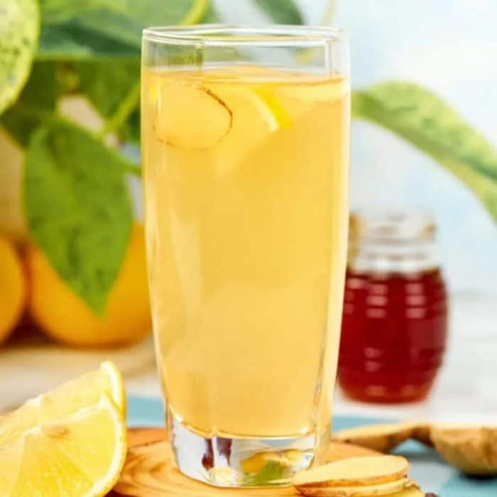 a glass of invigorating flavors with the warm spice of ginger, the tartness of lemon, the mild sweetness of honey, and the tangy depth of apple cider vinegar