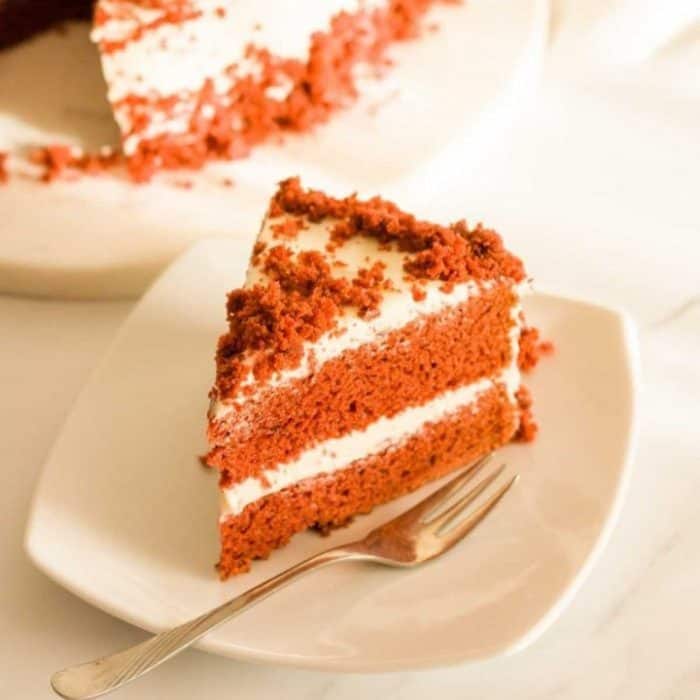 This eggless red velvet cake is a showstopper with its striking crimson hue and velvety texture.