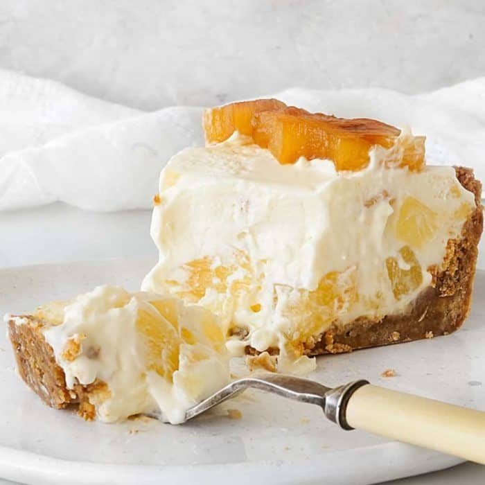 pineapple stars in a creamy, tangy filling with a crumbly graham cracker crust.