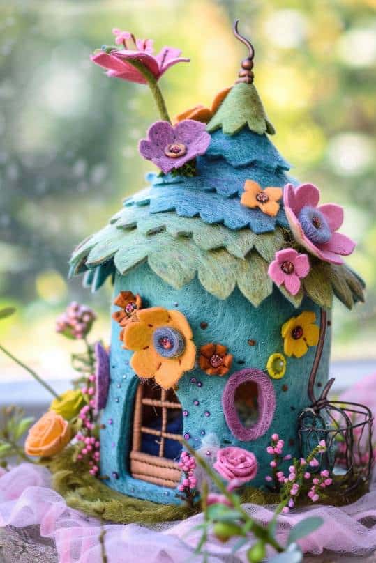 Fashion tiny abodes with layered felt for the walls and roofs and add details like doors, windows, and floral embellishments. 
