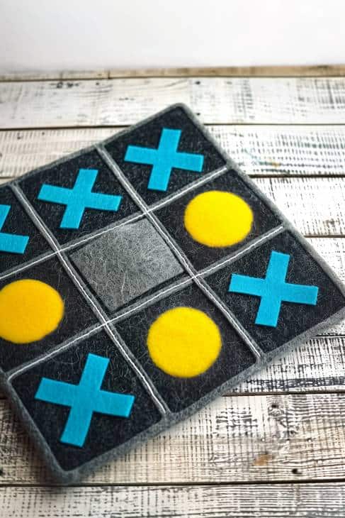 Fabricate a tic-tac-toe board from felt, creating a durable and portable two-tone grid. 