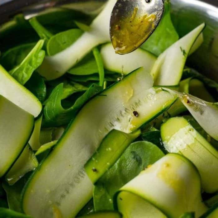 Delicate ribbons of zucchini are the stars of this salad, dressed in an innovative and elegant Earl Grey dressing that lightly clings to each strip.