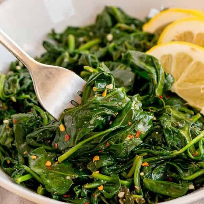 A healthy side of sautéed spinach with garlic and lemon provides a light, aromatic, and slightly zesty counterpoint to your steak's robust character.