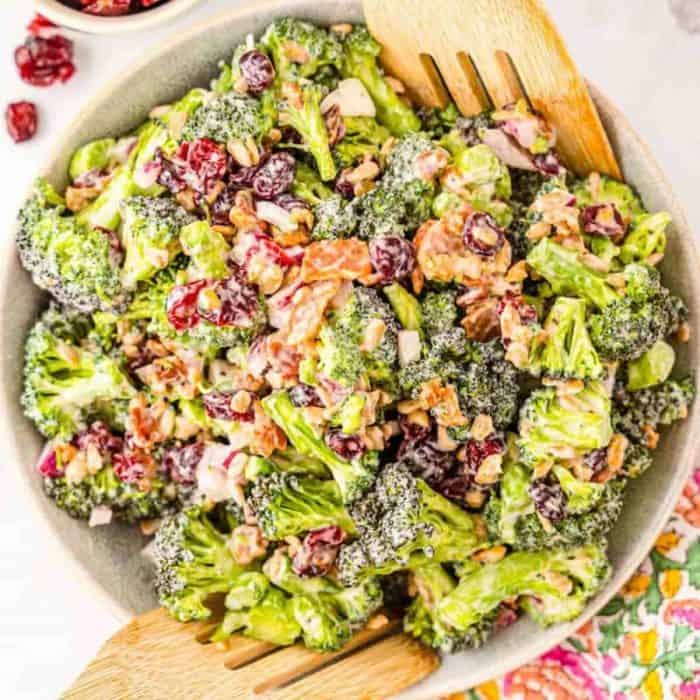 Crunchy, creamy, and flavorful, this side salad combines broccoli florets, bacon, dried cranberries, red onions, and sunflower seeds — all enveloped in a creamy, slightly tangy dressing.
