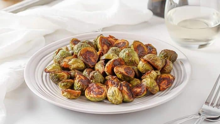 Yes, Brussels sprouts can become an irresistible steak side when marinated in a bright, salty-and-sweet dressing before being roasted.