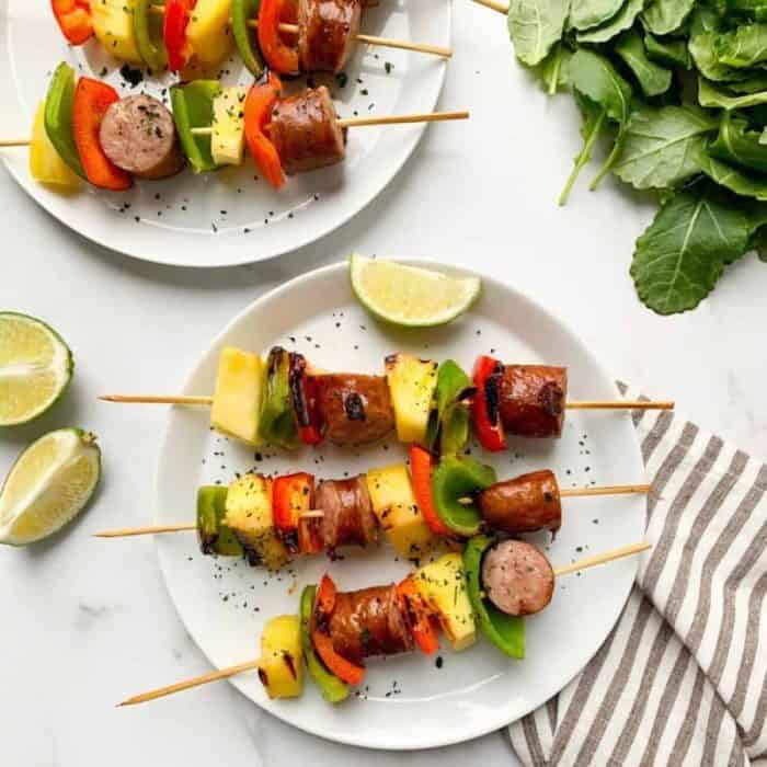 These kielbasa skewers with red and green peppers and fresh pineapple are packed with vibrant flavors.